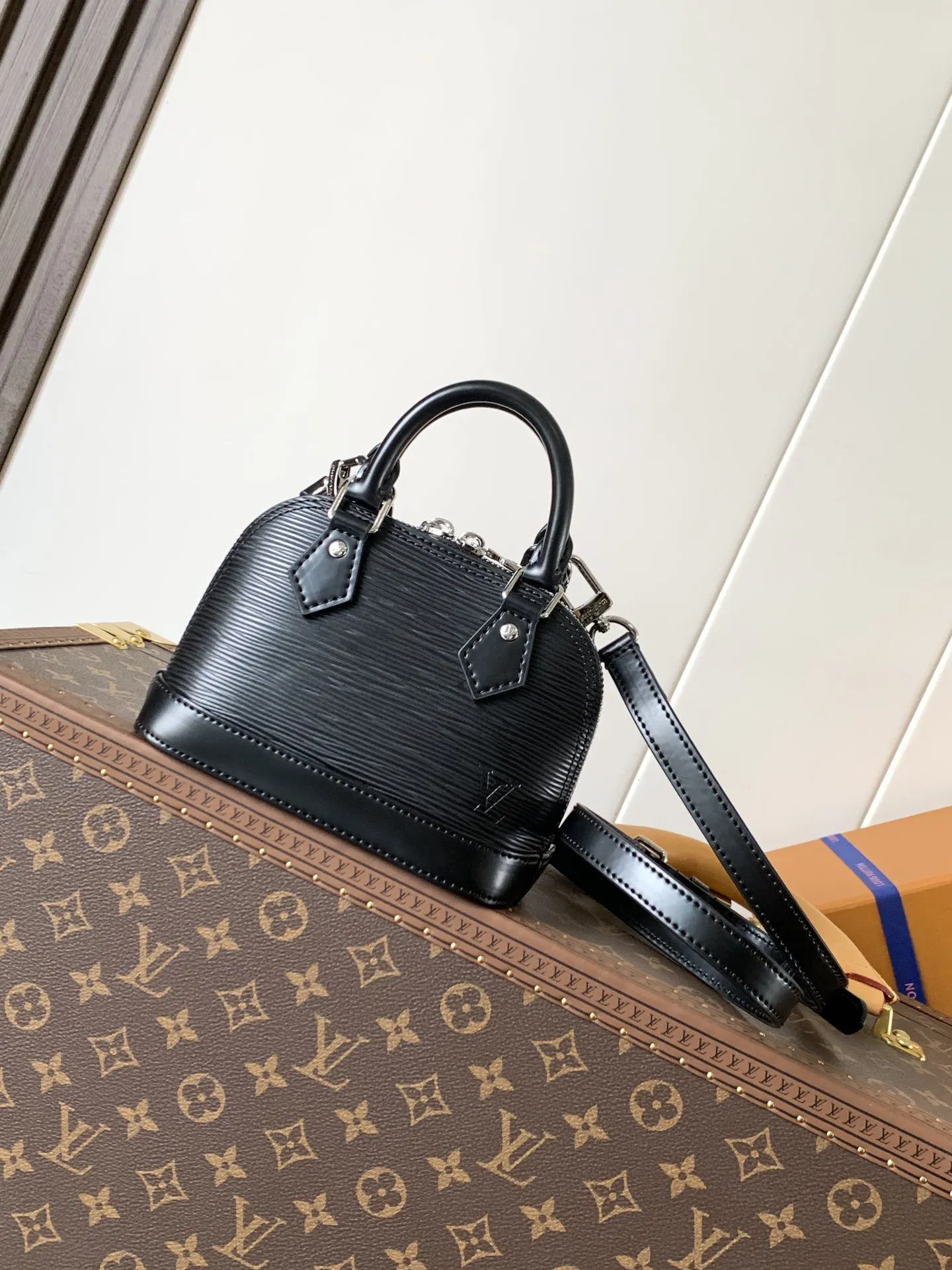 LV Alma black and white color scheme shell bag