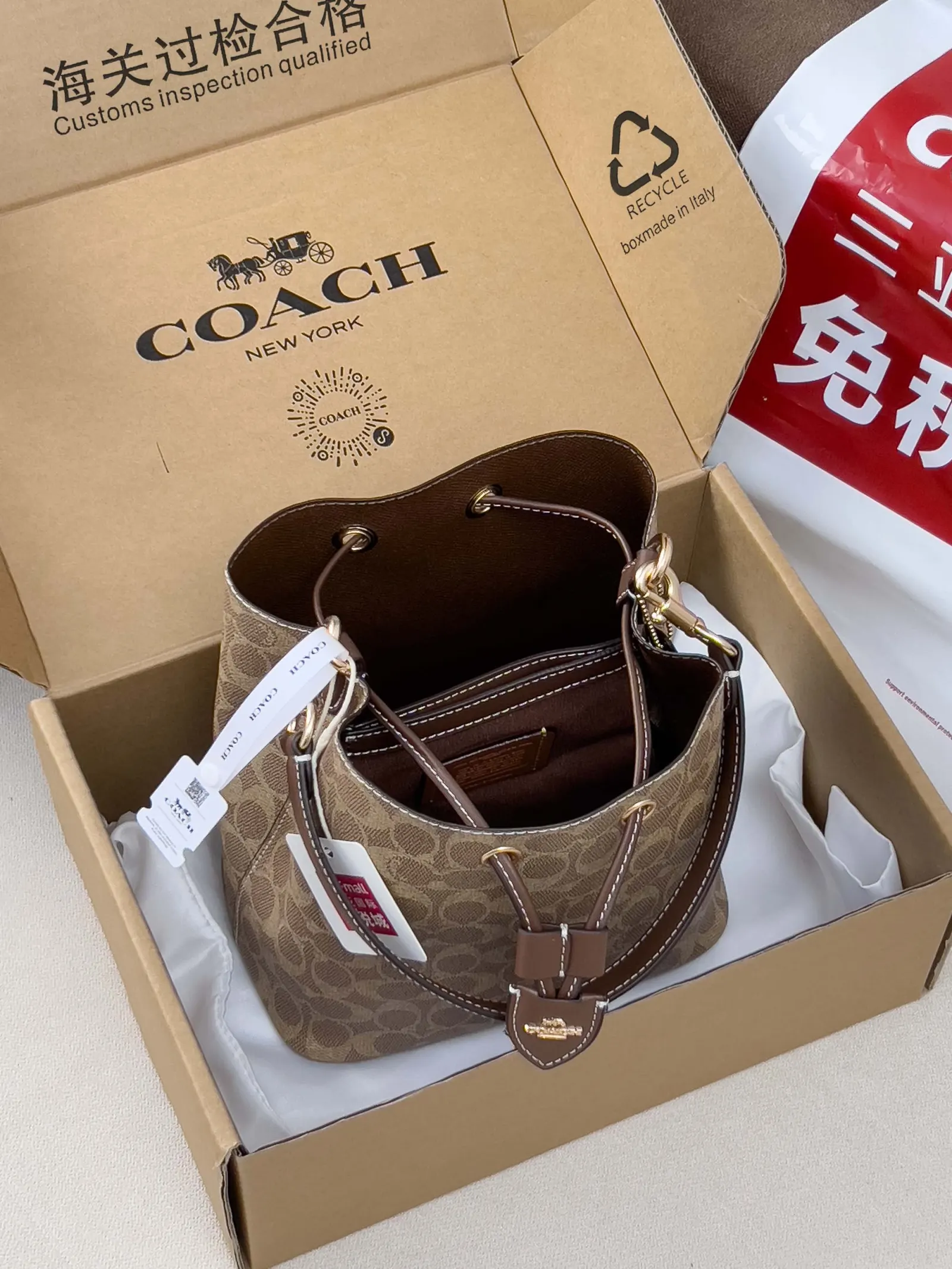 Coach 老花 图片 家经典老花Rowan抽绳单 腋下包 复古腋下背款