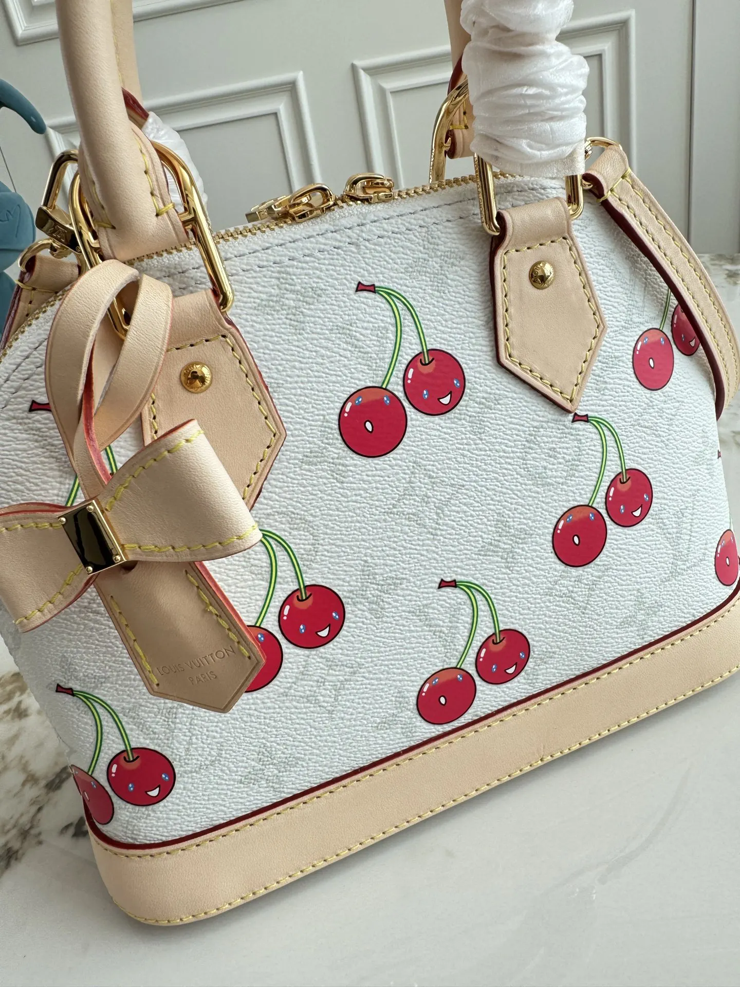 Louis Vuitton Alma Monogram Handbag