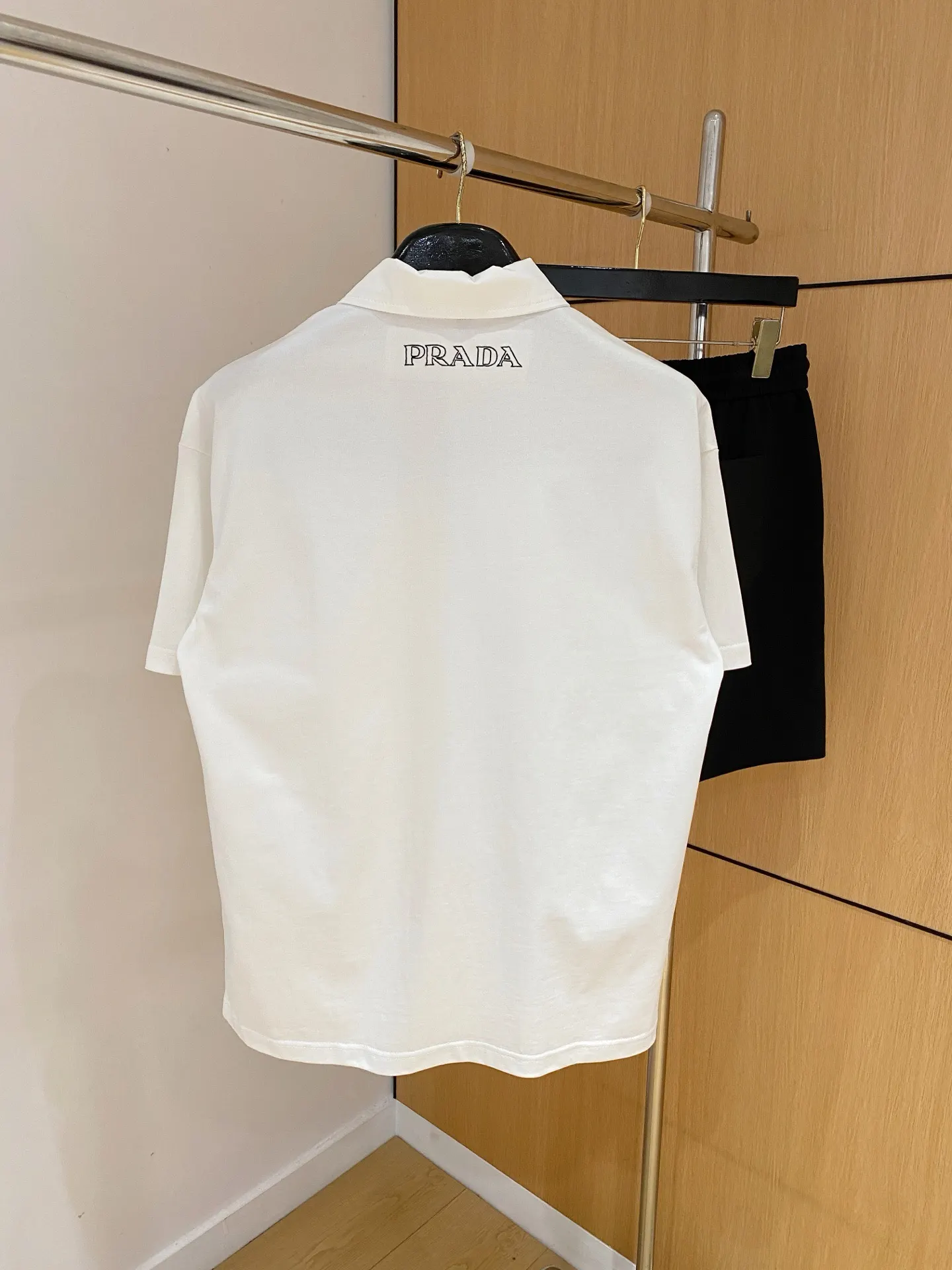 Prada Triangle Logo Zip Polo Shirt In White