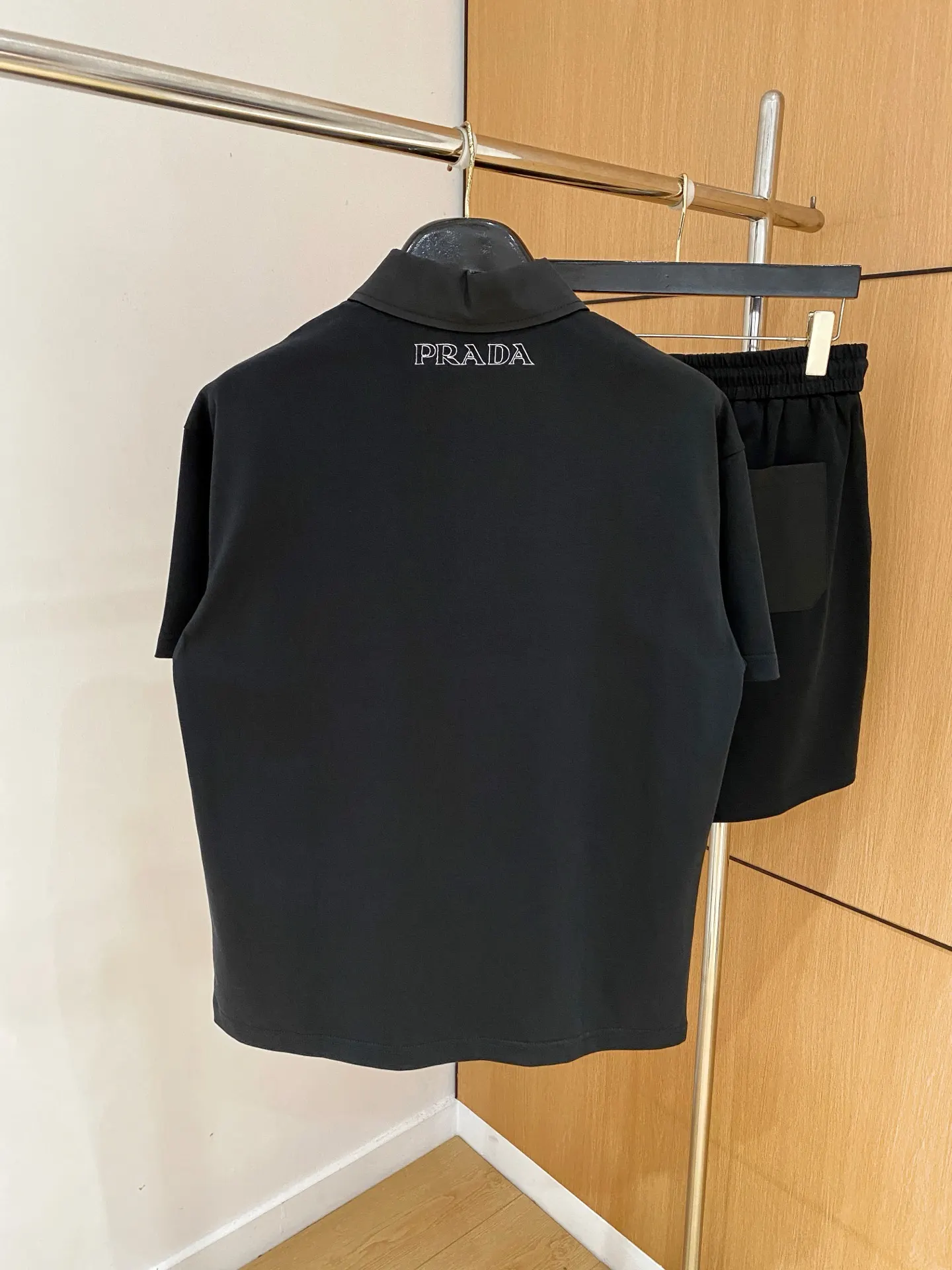 Prada Triangle Logo Zip Polo Shirt In Black