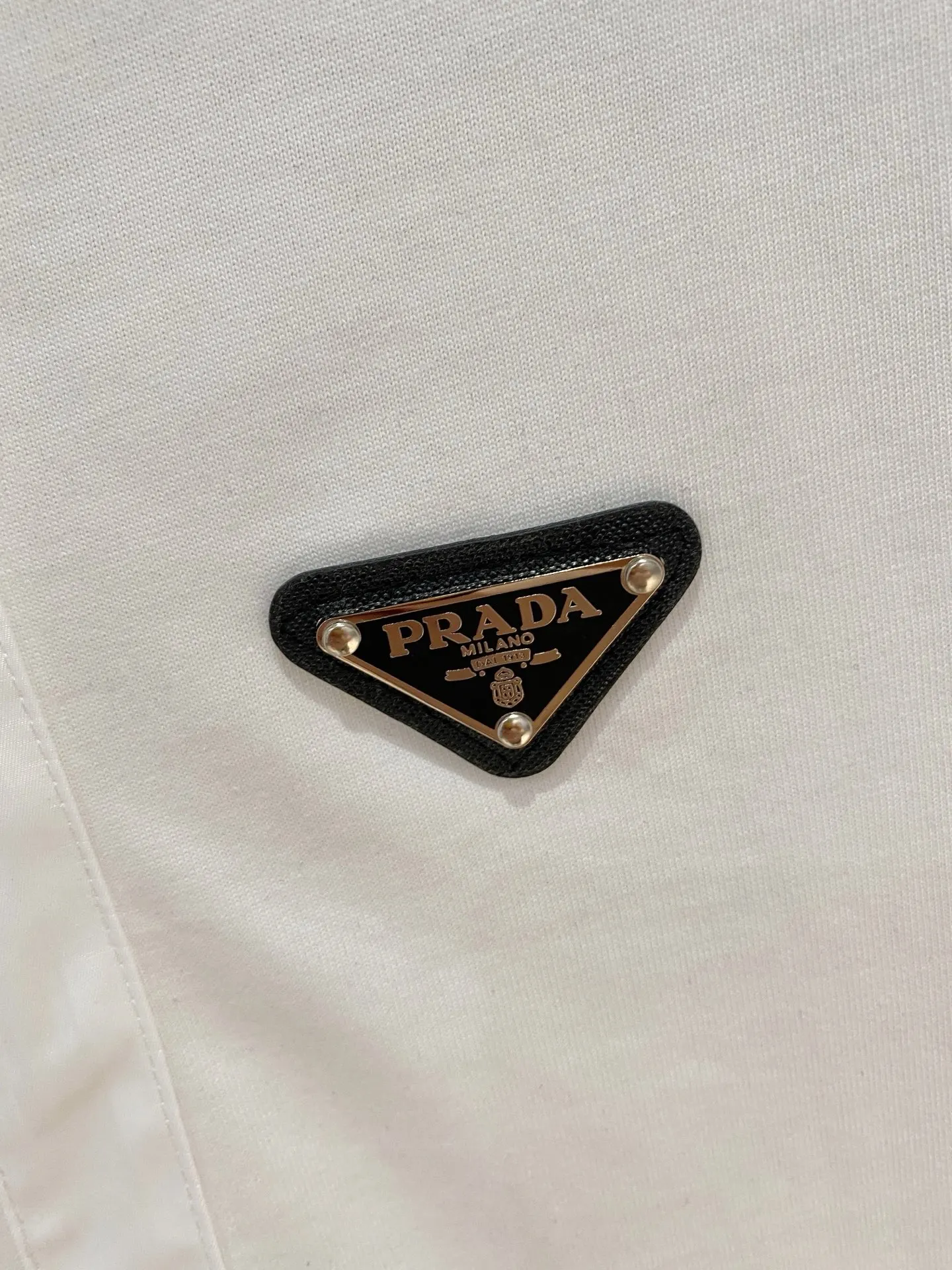 Prada Triangle Logo Zip Polo Shirt In White