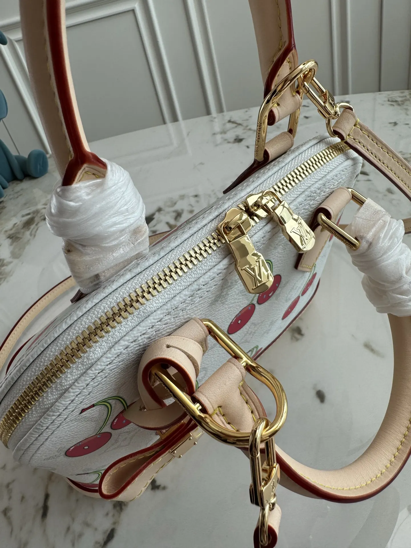 Louis Vuitton Alma Monogram Handbag