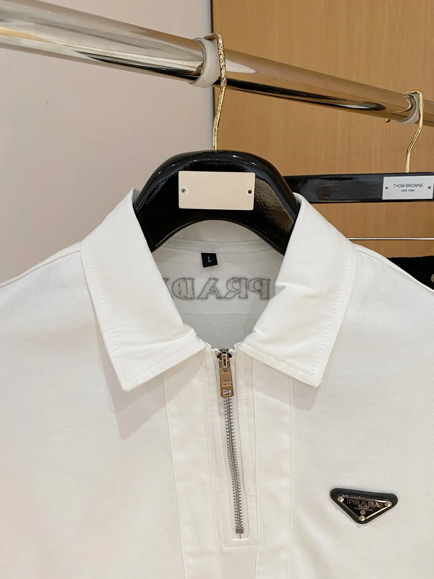 Prada Triangle Logo Zip Polo Shirt In White
